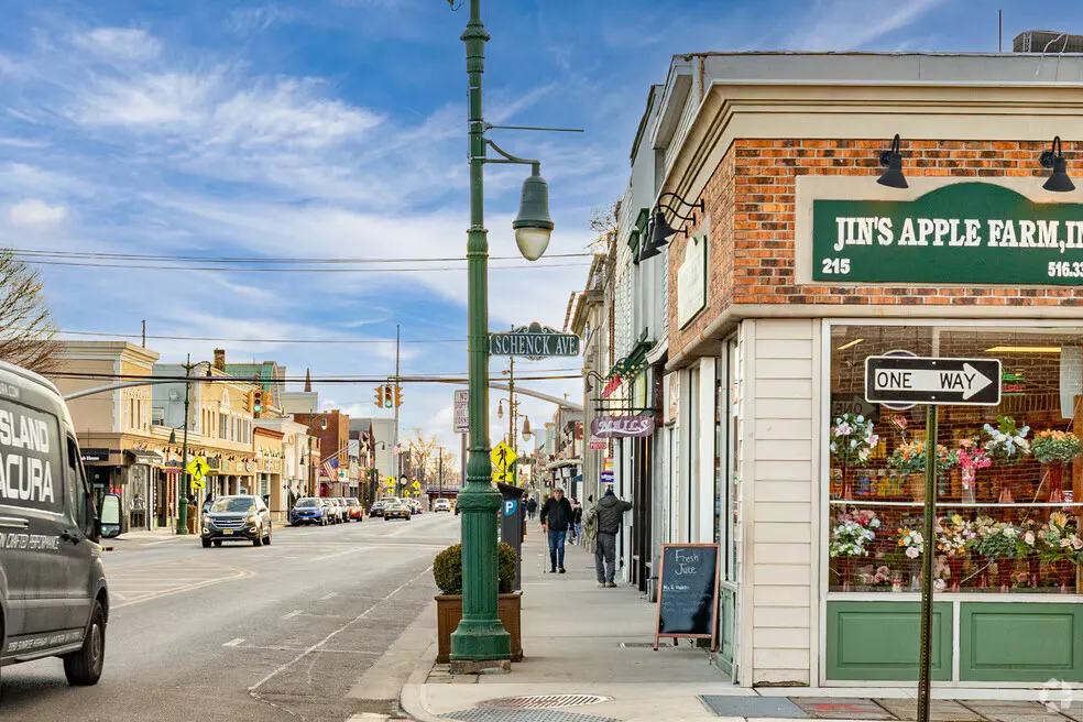 Downtown Westbury, NY — local shops and the village's signature green lampposts along Schenck Avenue
